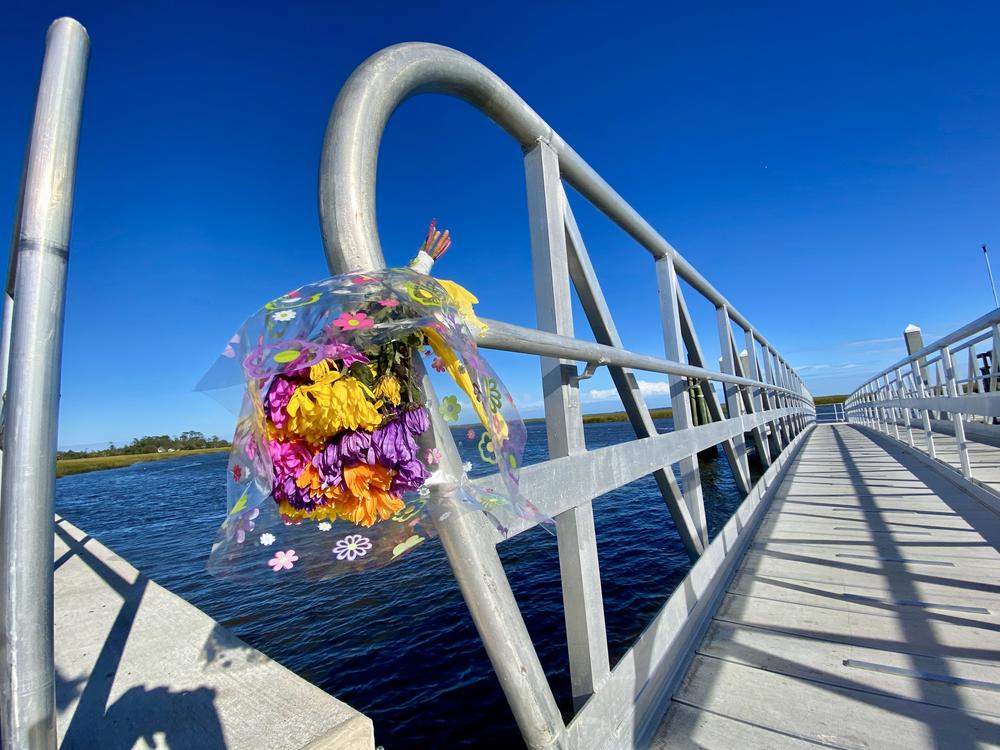 A bouquet of flowers is affixed to the McIntosh County mainland dock near Sapelo Island.