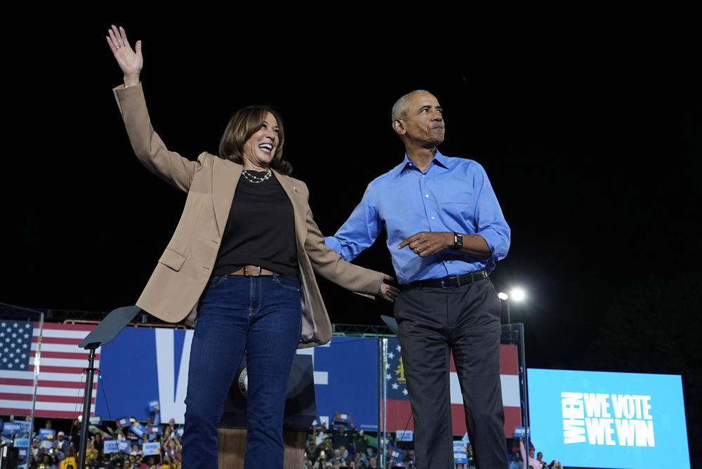 Democratic presidential nominee Vice President Kamala Harris waves with former President Barack Obama at a campaign rally at James R. Hallford Stadium, Thursday, Oct. 24, 2024, in Clarkston, Ga.