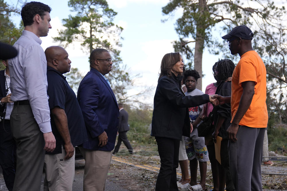 Democratic presidential nominee Vice President Kamala Harris greets people who were impacted by Hurricane Helene in Augusta, Ga., Wednesday, Oct. 2, 2024, as from left, Sen. Jon Ossoff, D-Ga., FEMA deputy direct Erik Hooks and Augusta Mayor Garnett Johnson watch. 