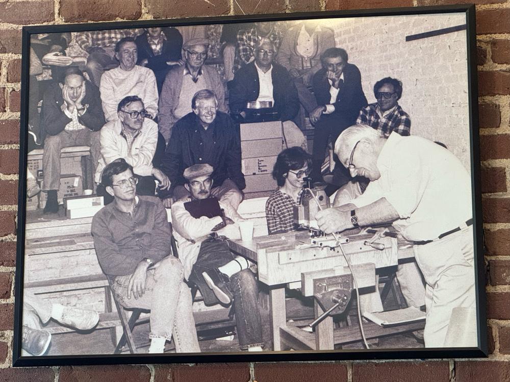 Former President Jimmy Carter shown in a 1984 woodworking class at Highland Woodworking.