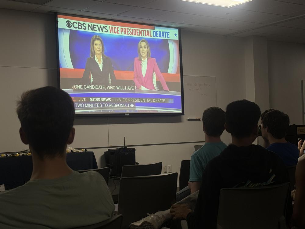 Students watch debate