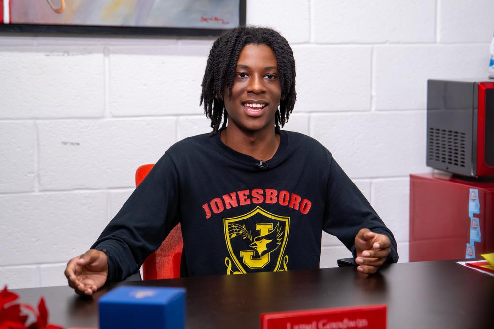 Kofi Martin, junior and mellophone player at Jonesboro High School, sits for an interview with GPB News.