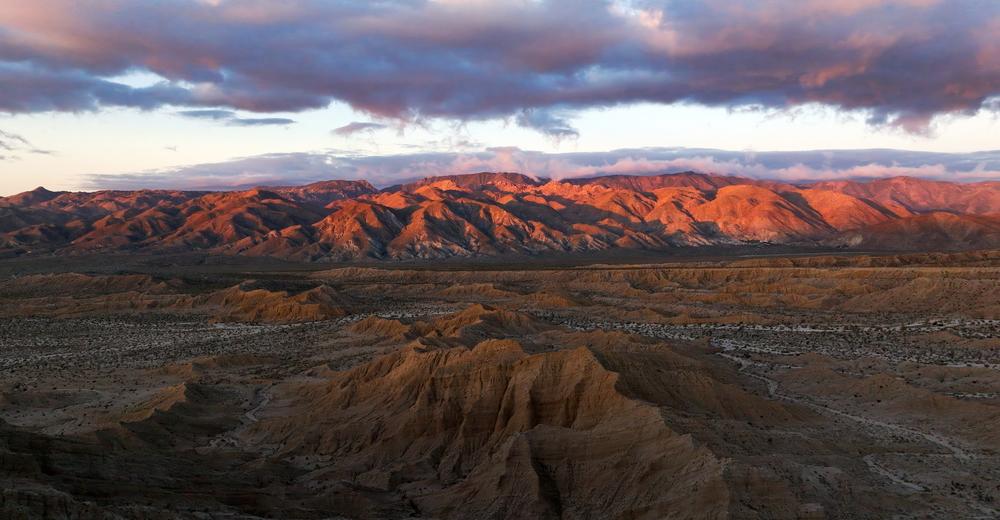 The first light of day shows itself on the mountains surrounding Anza, California.