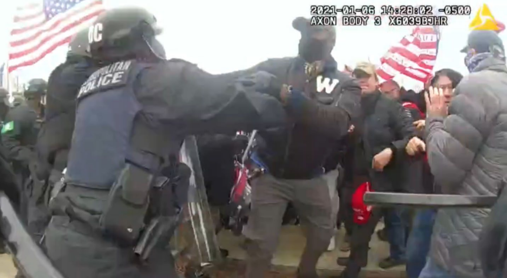 Leander Antwione Williams, identified by the FBI as the man with a “W” on his shirt, is seen on bodycam footage in an altercation with police officers during the Jan. 6, 2021, attack on the U.S. Capitol.