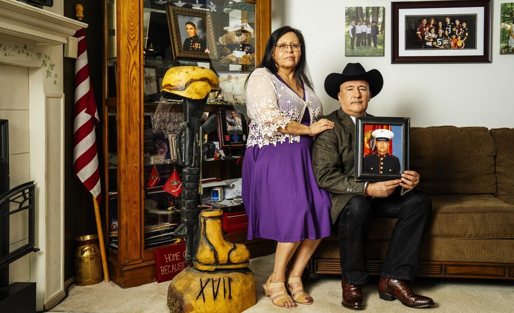 Yolanda Gonzales and Adan Gonzales, Sr. holding a photo of their son Sgt. Adan Gonzales, Jr. Gold Star parents of Sgt. Gonzales, who was killed in Afghanistan on August 7, 2011.