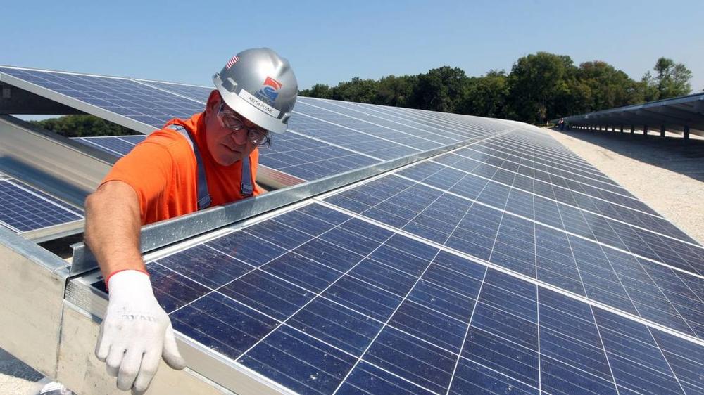 Keith Plume of PayneCrest Electric Company checks that solar panels are lined up correctly at the Ameren O’Fallon Renewable Energy Center in O’Fallon, Missouri on Sept. 18, 2014. Georgia is among the nation’s leaders for solar manufacturing this year. Bill Greenblatt UPI