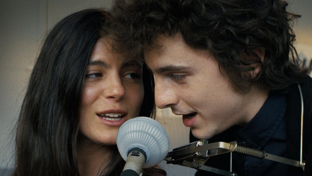 Monica Barbaro and Timothée Chalamet star as Joan Baez and Bob Dylan in the 2024 biopic, "A Complete Unknown."