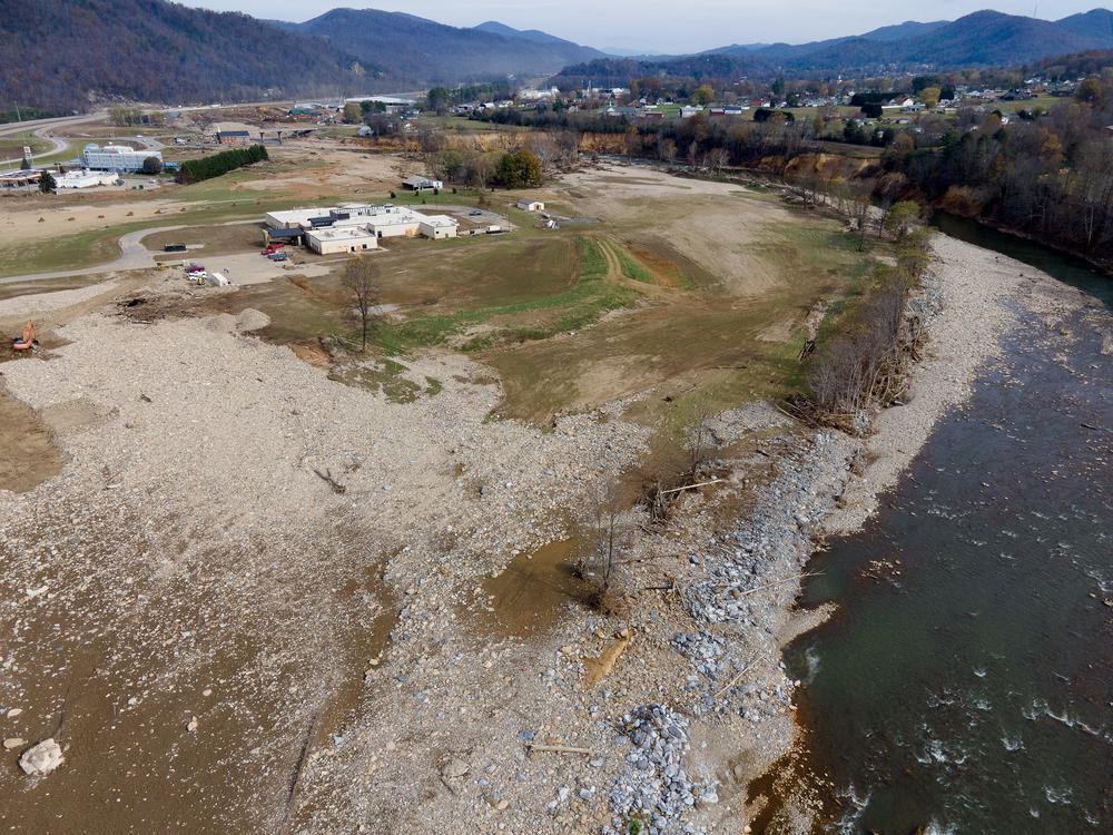 The Nolichucky River, which flows north through Erwin, Tennessee, was transformed into a deadly flash flood when rainfall from higher mountain altitudes drained into the river. The turbulent waters cut a path of destruction through Erwin that killed eight people. (MADDY ALEWINE FOR KFF HEALTH NEWS)