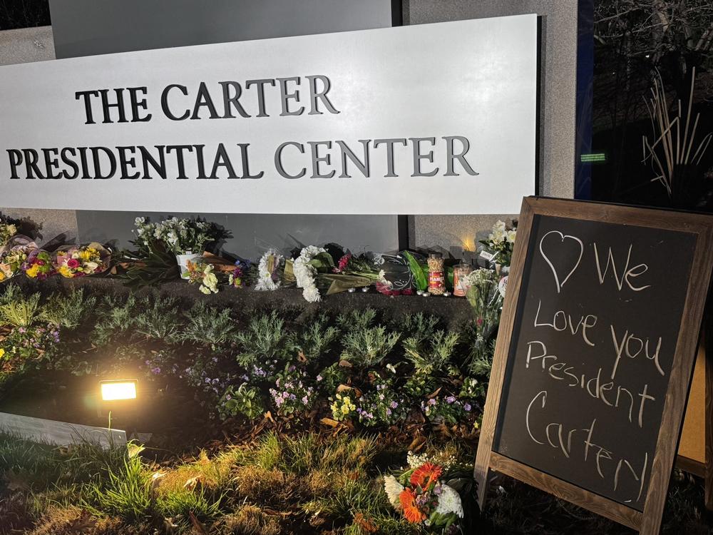 Flowers are laid at the entrance to the Carter Center in memory of Jimmy Carter, the 39th President of the United States who died on Dec. 29, 2024 at age 100.