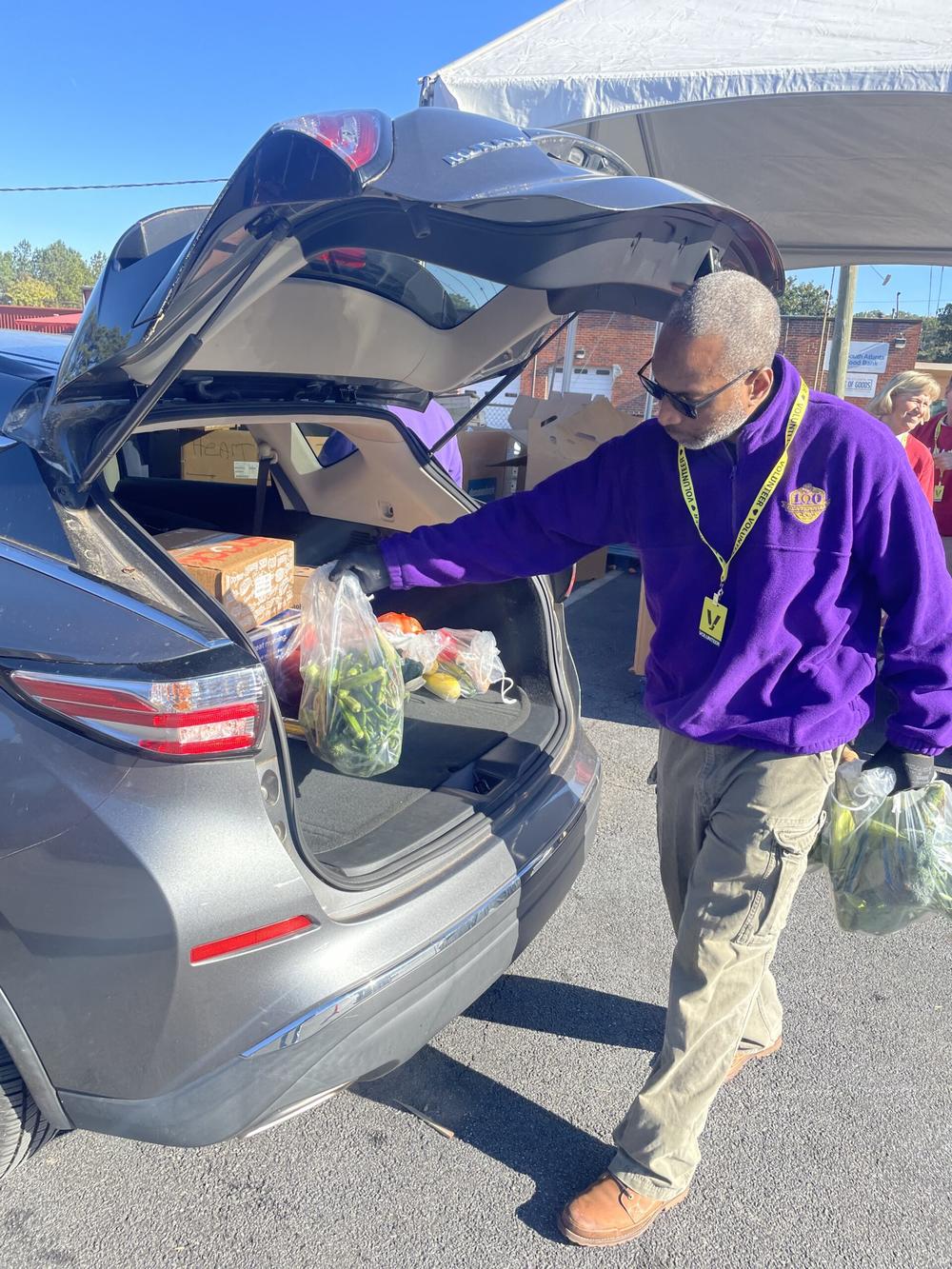 Caring For Others hosted its 24th annual food and household goods distribution event on Nov. 23 in Atlanta. The nonprofit distributed to several hundred families poultry, vegetables and other Thanksgiving fixings along with household goods like blankets and comforters. Photo from Caring For Others