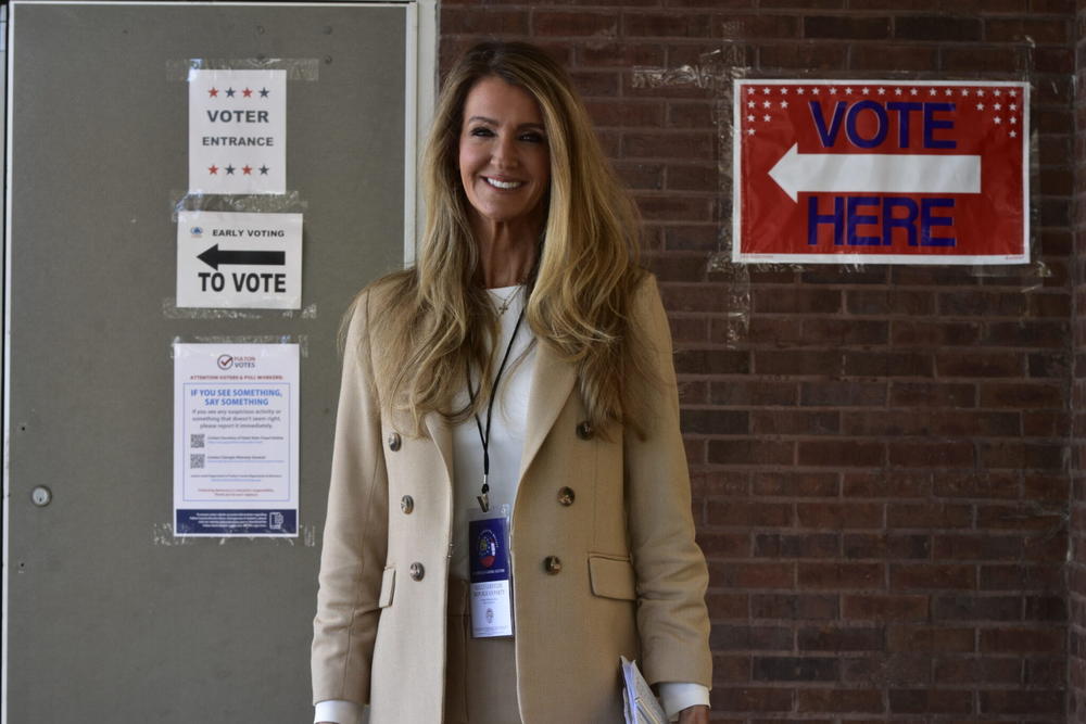  Former U.S. Sen. Kelly Loeffler exits an Atlanta polling place in October while working as a poll monitor during the 2024 election. Ross Williams/Georgia Recorder