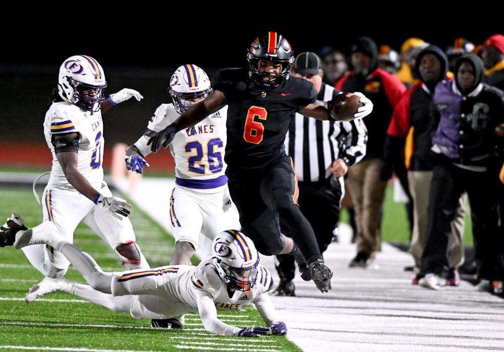 Northeast running back Nick Woodford (6) leaps over a defender during the Raiders’ 46-14 win over Fitzgerald in Friday night’s GHSA state semifinal game. Jason Vorhees / The Melody