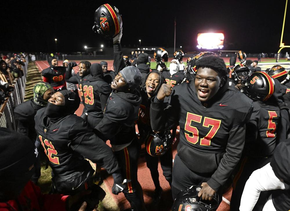 Northeast players celebrate their 46-14 win over Fitzgerald in Friday night’s GHSA state semifinal game. Jason Vorhees / The Melody