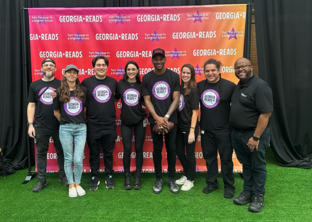 GPB production crew poses with Malcolm Mitchell during Georgia Reads Day.