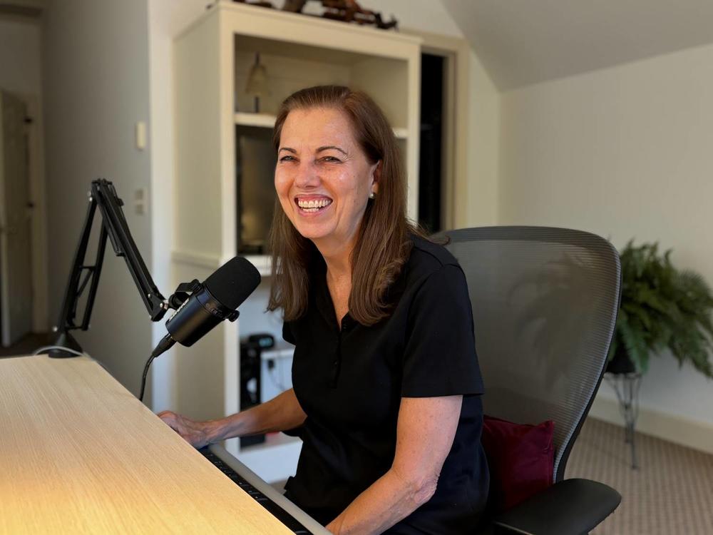 Nancy Treaster at her podcast desk