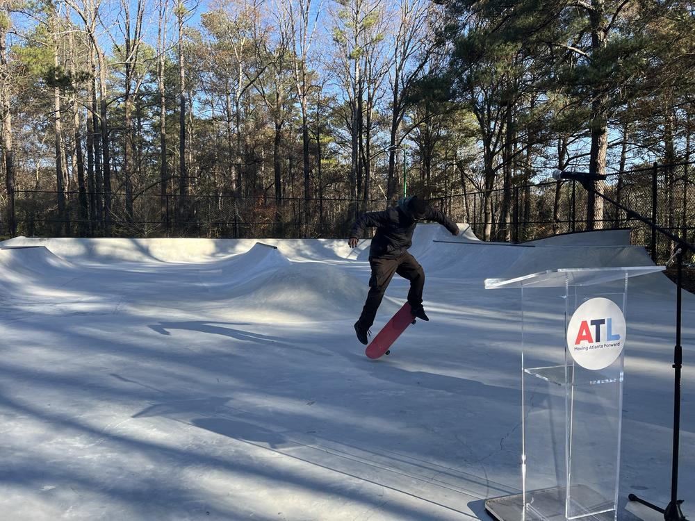 Jordan Patterson doing tricks on his skateboard before remarks begin at the grand opening of Ruby Harper Skatepark on Dec 20, 2024.