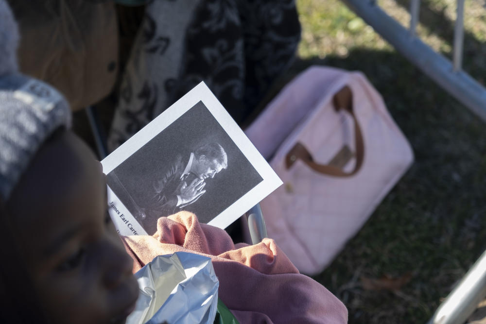 The Carter Center handed out funeral programs to visitors and Plains locals ahead of the motorcade’s arrival on Thursday. 