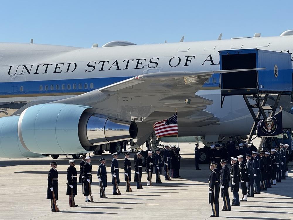 Uniformed military personnel line the path of Jimmy Carter's casket as his state funeral moves from Georgia to Washington, D.C.  Special Air Mission 39 flew his remains from Dobbins Air Reserve Base north of Atlanta.