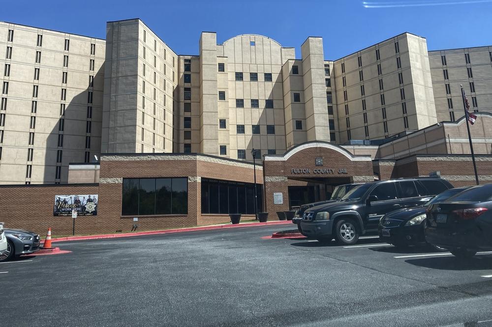 FILE - Vehicles are parked outside the Fulton County Jail, April 11, 2023, in Atlanta. (AP Photo/Kate Brumback, File)