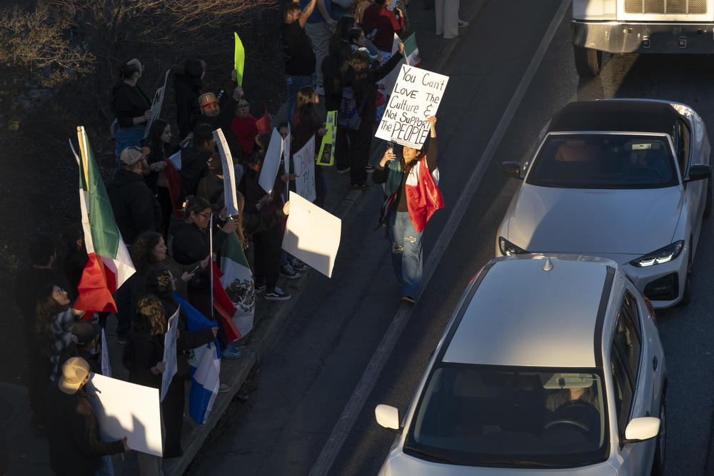 Crowds gathered along a main thoroughfare in Gainesville, Ga., on Jan. 29, 2025, to protest ICE and President Trump's expedited removal policy. The protest followed a weekend of sweeps by ICE and the Department of Homeland Security across Georgia.