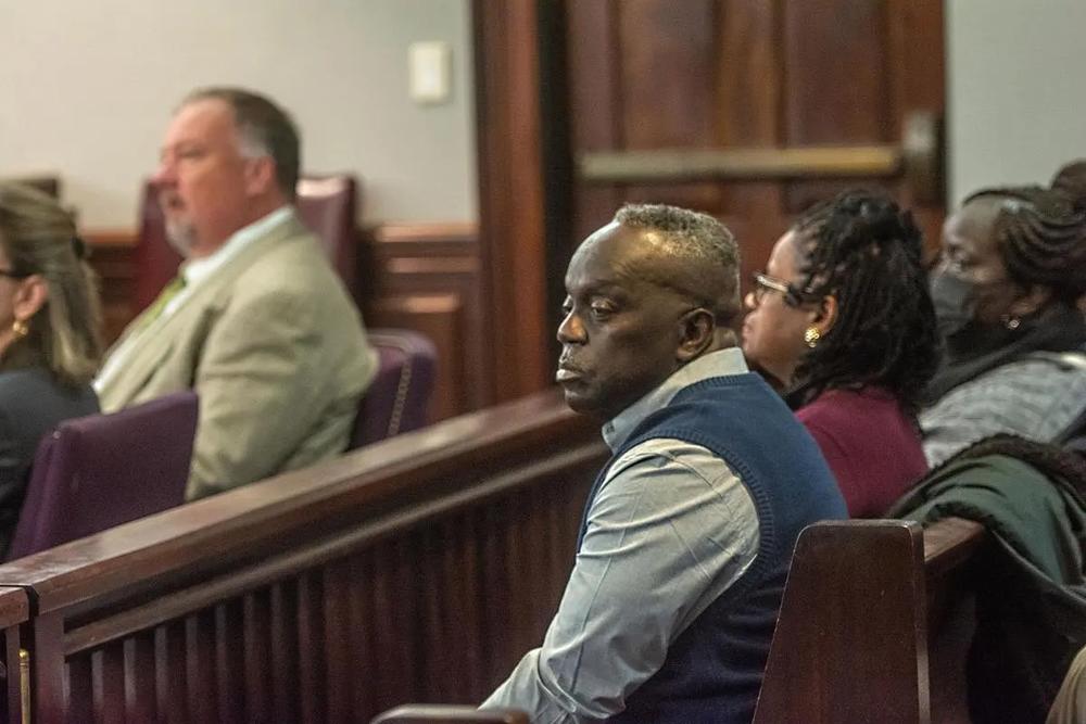 Marcus Arbery listens to jury selection on Tuesday during the first day of the trial of former District Attorney Jackie Johnson, who is accused of interfering with the police investigation into the 2020 shooting death of his son, Ahmaud Arbery. (Michael Hall/Brunswick News)