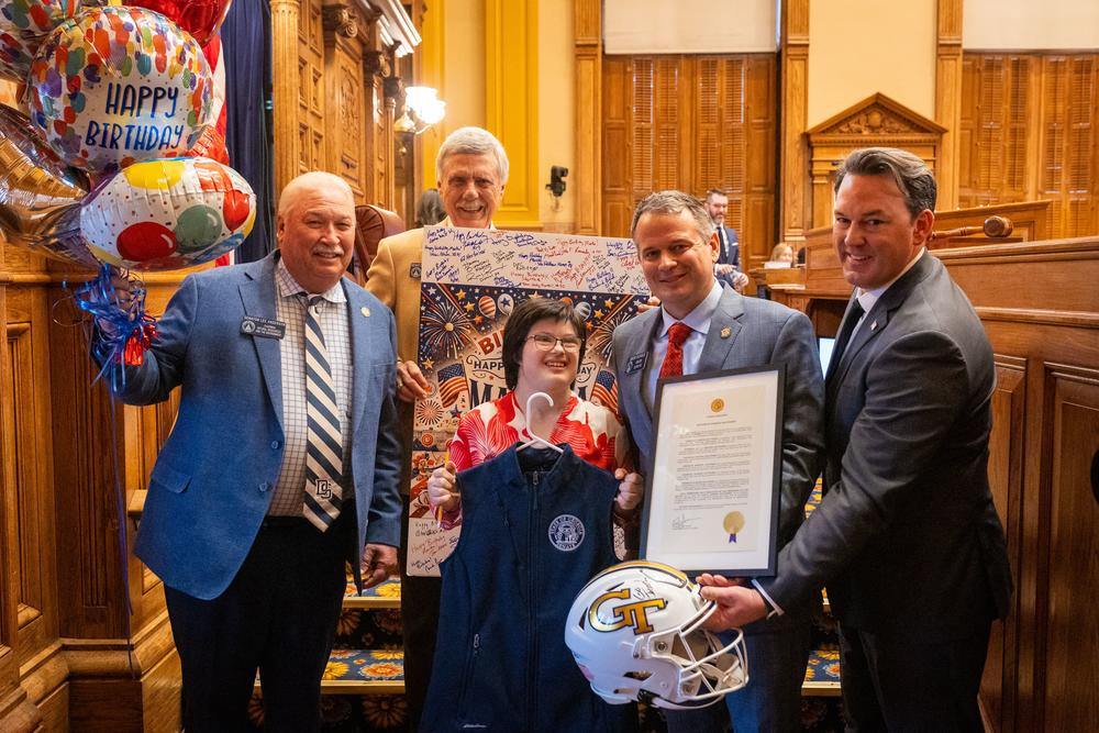 Martha Haythorn (center) pictured with Georgia Sens. Jason Anavitarte (R-Dallas), Max Burns (R-Sylvania), and Bo Hatchett (R-Cornelia) after the Senate floor celebrated her 25th birthday. (Georgia Senate)