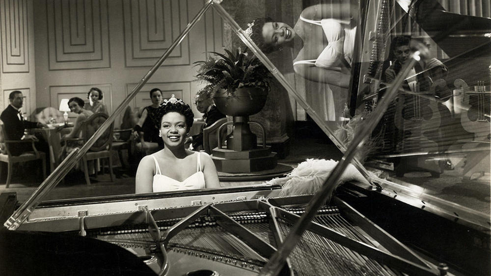 Hazel Scott sitting at a piano.