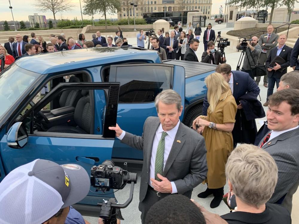 Gov. Brian Kemp steps out of a Rivian truck at December 2021 press event announcing the the electric vehicle maker will build a factory in Georgia. Jill Nolin/Georgia Recorder (file photo)