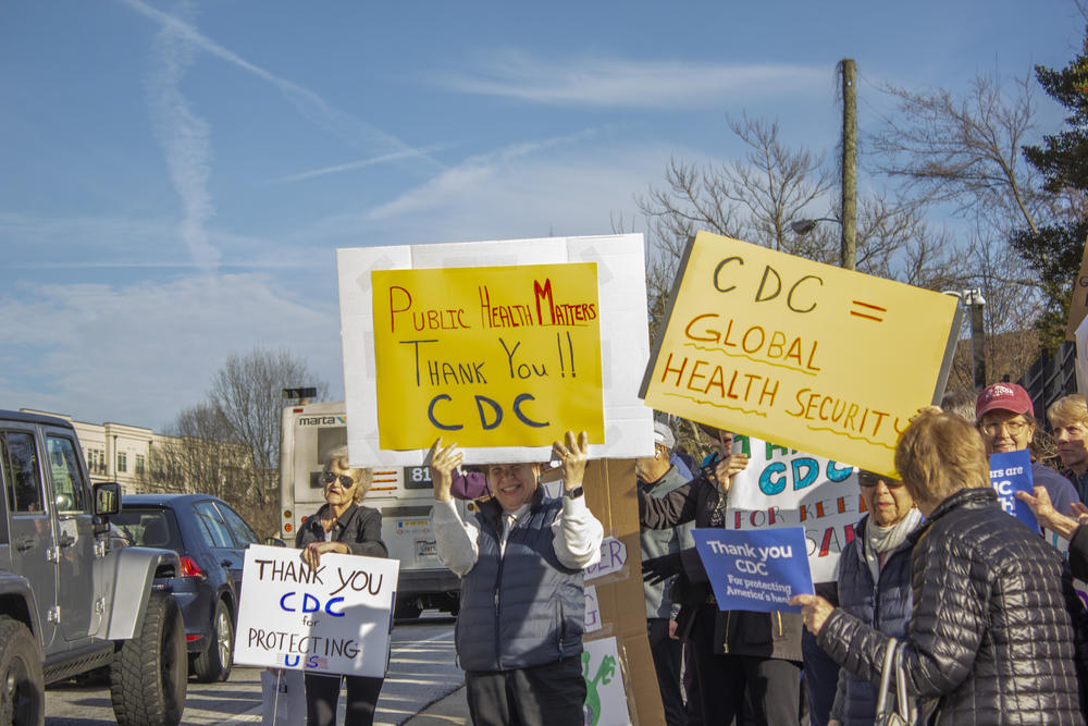 A demonstration at the Atlanta-based Centers for Disease Control and Prevention headquarters on Feb. 18, 2025, saw retired public health workers and others join to support current CDC employees as they left work to go home. Thousands have been terminated from agencies under the Department of Health and Human Services in recent days — a move that could threaten disease response.