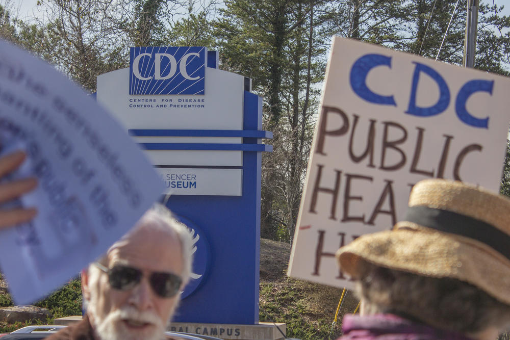 A demonstration at the Atlanta-based Centers for Disease Control and Prevention headquarters on Feb. 18, 2025, saw retired public health workers and others join to support current CDC employees as they left work to go home. Thousands have been terminated from agencies under the Department of Health and Human Services in recent days — a move that could threaten disease response.