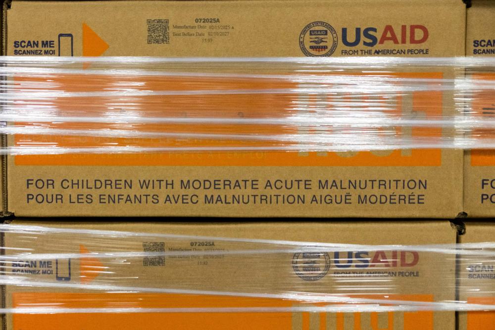 Mana boxes bearing the USAID logo and slogan: From the American People. 