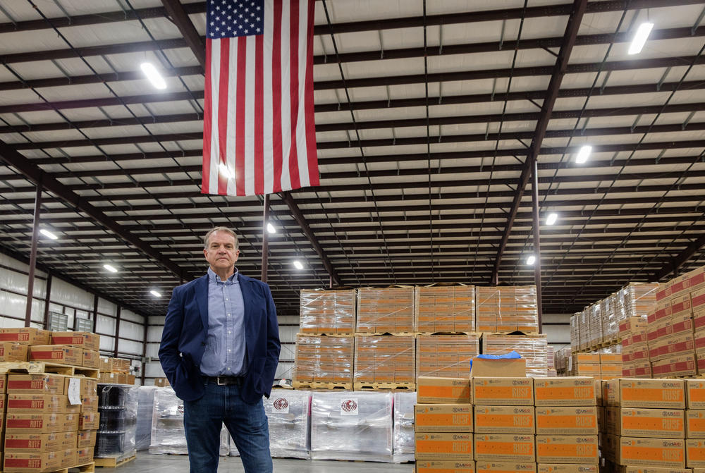 Mana CEO Mark Moore on the floor of the company's Fitzgerald factory, surrounded by ready to ship pallets of MANA product. 