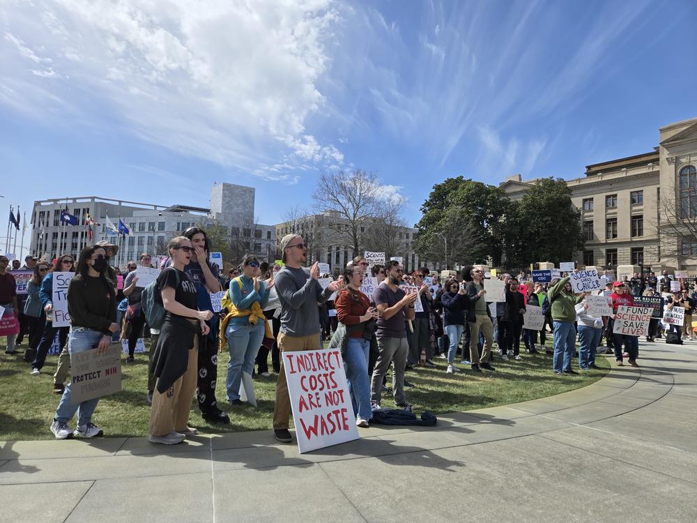 More than 100 scientists, researchers and their supporters showed up for the stand up for science rally outside the Georgia State Capitol this afternoon/Friday. GPB’s Amanda Andrews reports they were there to speak out against federal funding cuts affecting workers as part of a national day of action.