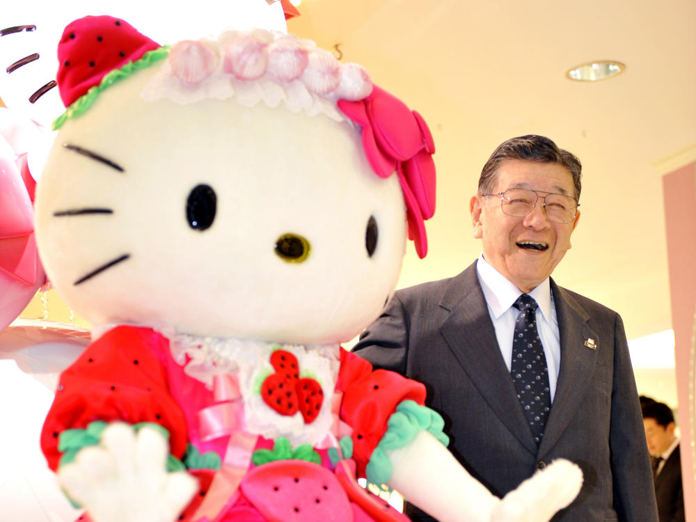 Sanrio founder Shintaro Tsuji poses with Hello Kitty in 2009 as the company opens the world's largest Sanrio shop in Tokyo.