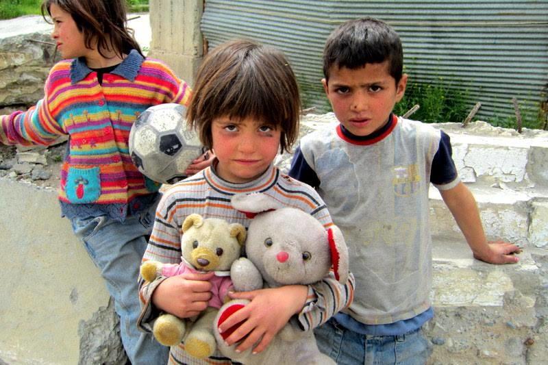 Children in Kobani, Syria scavenging in the rubble.
