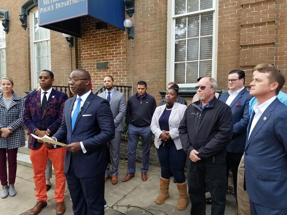 Antwan Lang of the Savannah Jaycees (center), along with leaders of National Action Network, the Young Democrats and Republicans and other groups, calls for the Savannah-Chatham Metropolitan Police Department to remain merged.