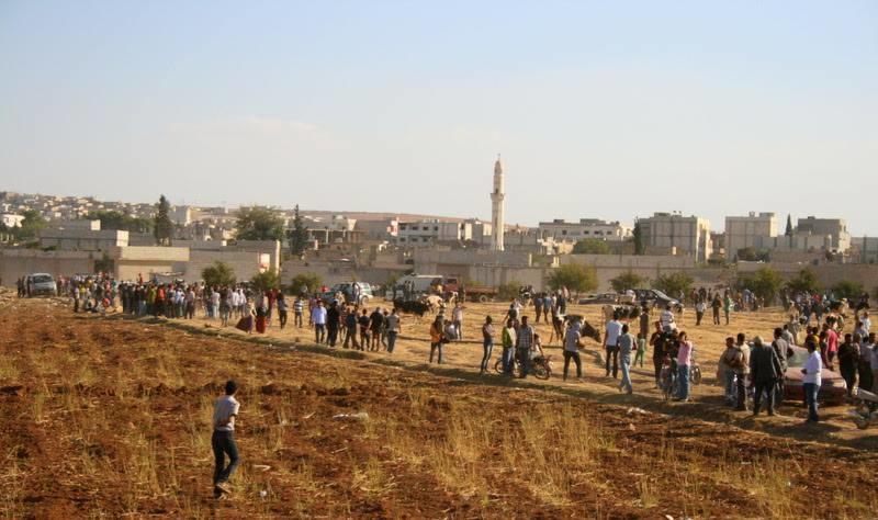 Kurdish civilians marching into Kobani, Syria to fight against ISIS.