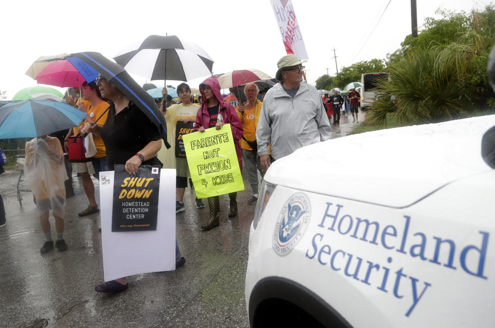 Protestors march outside of the Homestead Temporary Shelter for Unaccompanied Children, Sunday, June 16, 2019, in Homestead, Fla. A coalition of religious groups and immigrant advocates said they want the Homestead detention center closed.