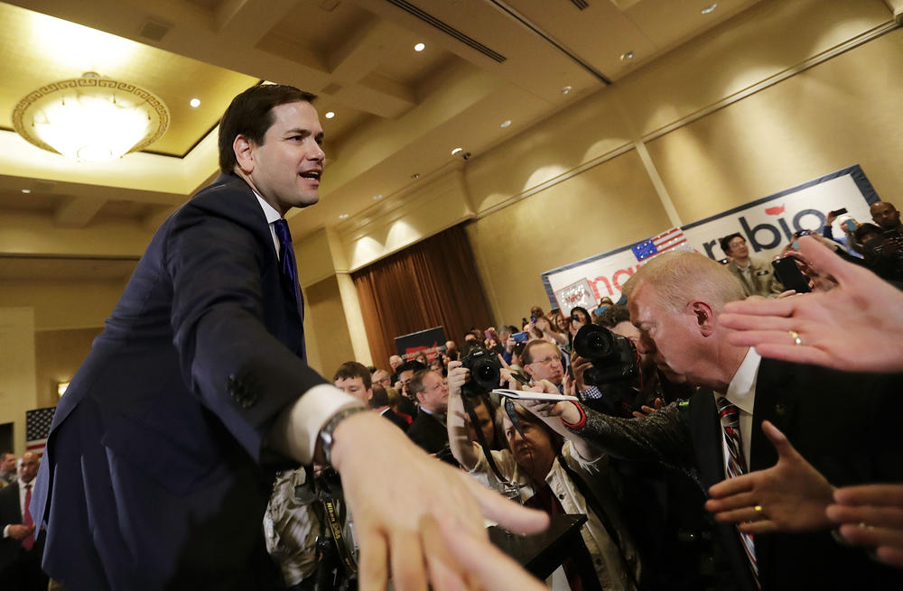 Republican presidential candidate, Sen. Marco Rubio, R-Fla., shakes hands with audience members after speaking at a campaign event at the InterContinental Hotel Monday, Feb. 29, 2016, in Atlanta. 