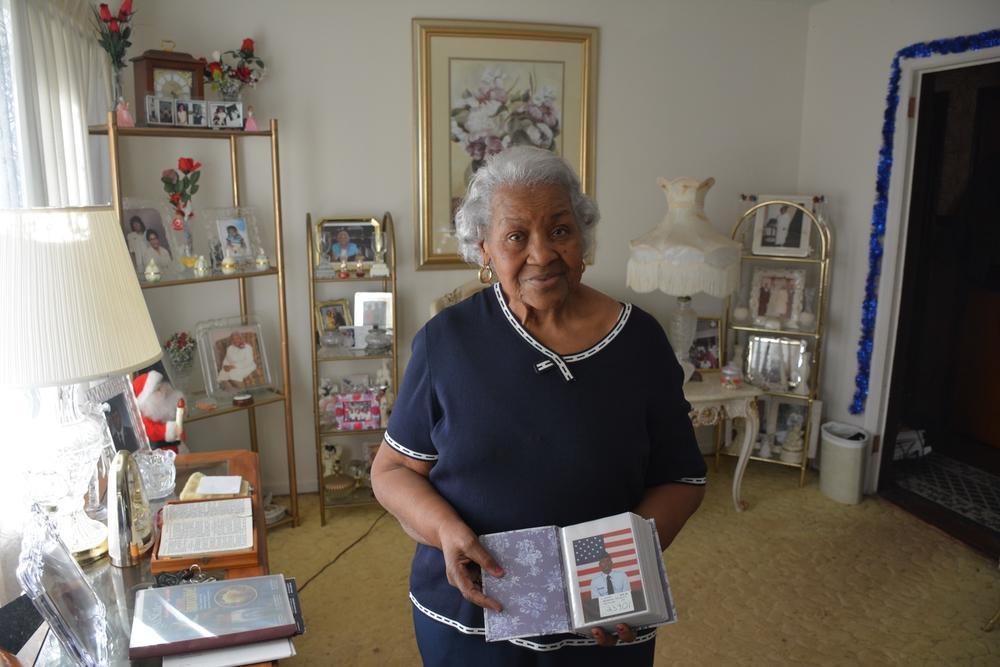 Bernice Smith showing one of the many photos of her grandson, Stephen Smith, in the living room of her Decatur, Georgia home.
