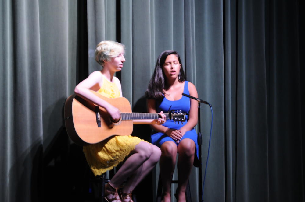 Lee McCombs and Sarah Hassine performing their original song, 