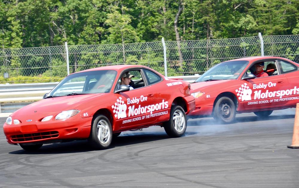 Bobby Ore leads another session at his stunt driving school at Atlanta Motorsports Park in Dawsonville, Georgia.