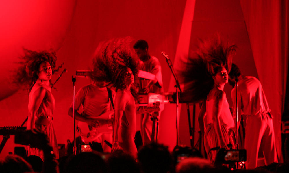 Singer and songwriter Solange Knowles (left) performs with her backup singers.