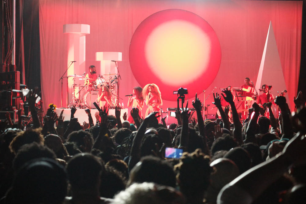 Singer and songwriter Solange Knowles (left) performs in front of her fans.