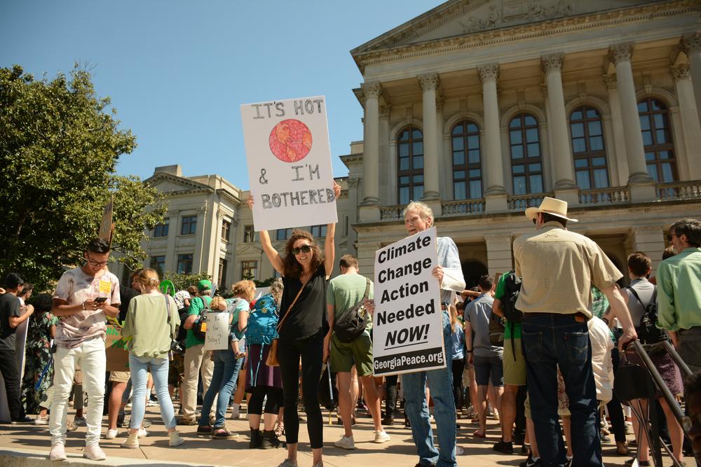 Adults were some of the hundreds of people to show up to participate in the climate srike in Atlanta. 