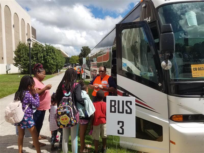 Evacuees board buses outside the Savannah Civic Center heading to Augusta ahead of Hurricane Dorian in September 2019.