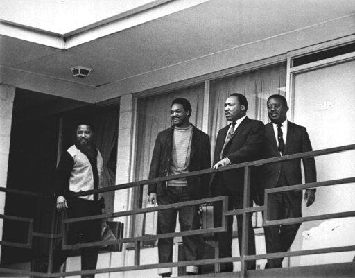 The Rev. Martin Luther King Jr. stands with other civil rights leaders on the balcony of the Lorraine Motel in Memphis, Tenn., on April 3, 1968, a day before he was assassinated at approximately the same place.