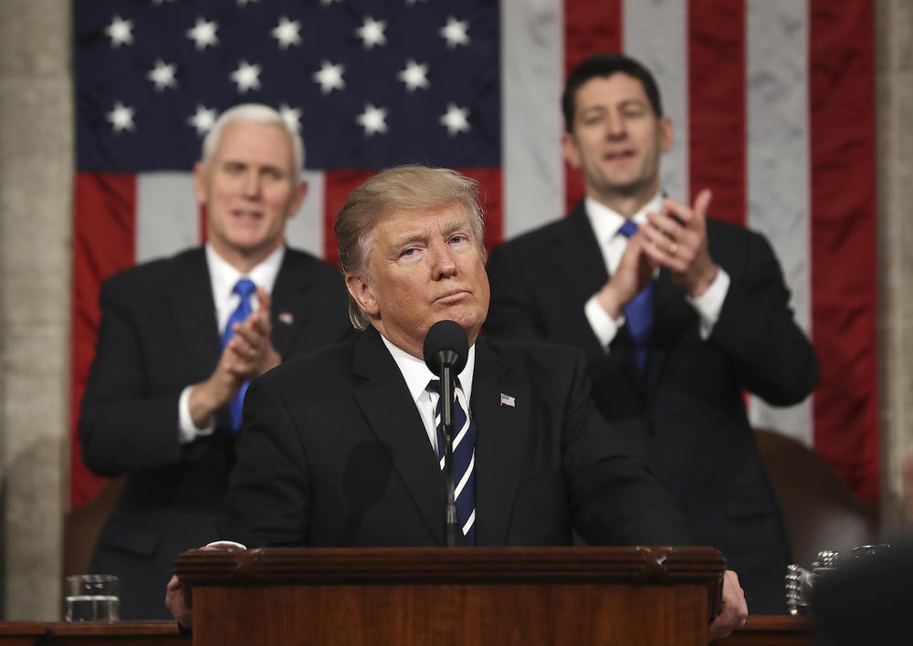 President Donald Trump addresses a joint session of Congress on Capitol Hill in Washington, Tuesday, Feb. 28, 2017, as Vice President Mike Pence and House Speaker Paul Ryan of Wis., listen.