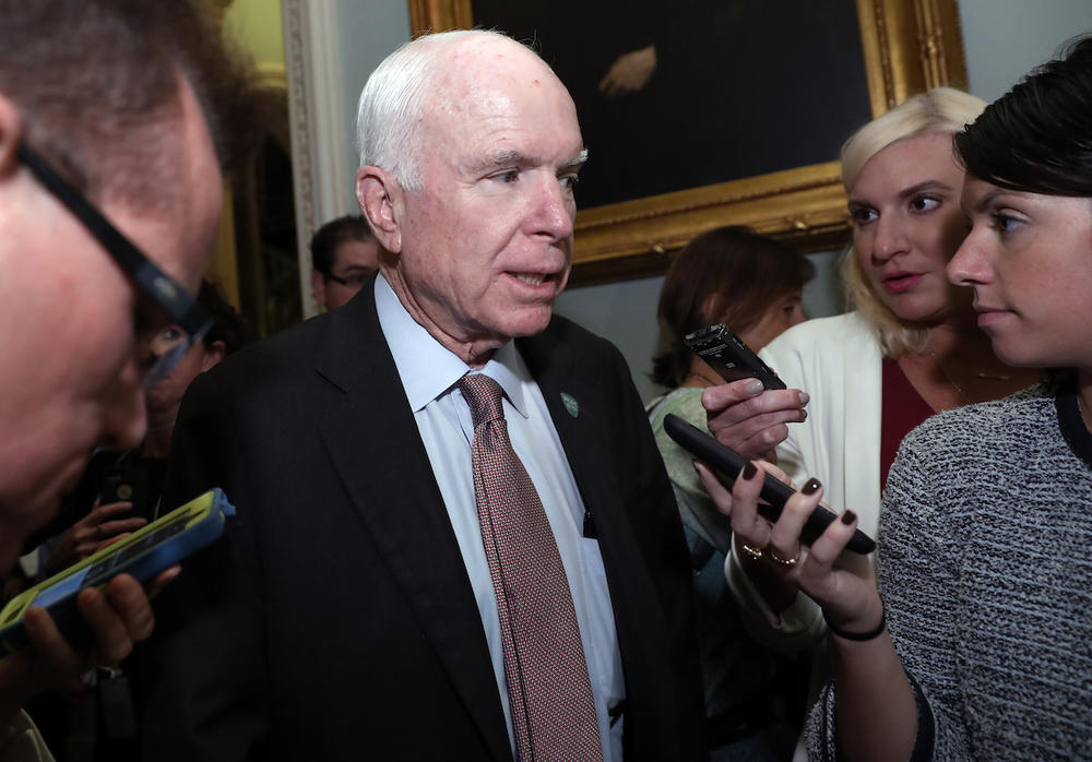 Sen. John McCain, R-Ariz., speaks with reporters before heading into a policy luncheon on Capitol Hill, Tuesday, Sept. 19, 2017, in Washington. 