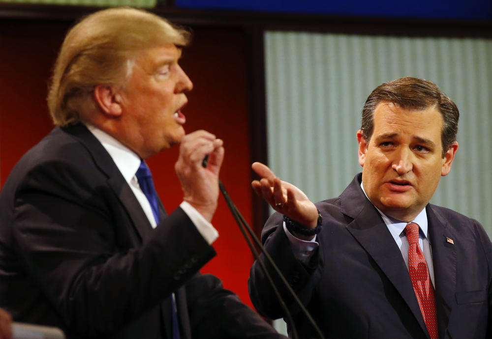 Republican presidential candidates, businessman Donald Trump and Sen. Ted Cruz, R-Texas, argue a point during a Republican presidential primary debate at Fox Theatre, Thursday, March 3, 2016, in Detroit. 